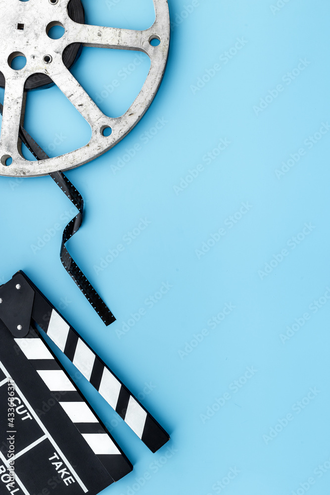 Motion picture film reel with movie clapper. Cinema concept Stock Photo