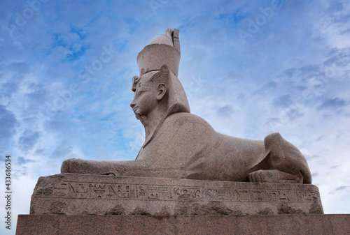 Ancient Egyptian sphinx on Universitetskaya embankment of Neva river in front of Imperial Academy of Arts, Saint Petersburg, Russia photo