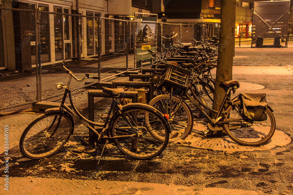 bicycles with snow on it in the small town of Doetinchem during Corona lockdown