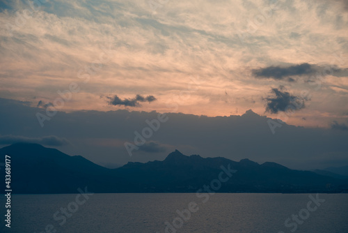 Beautiful natural landscape with mountains, sea and cloudy sky