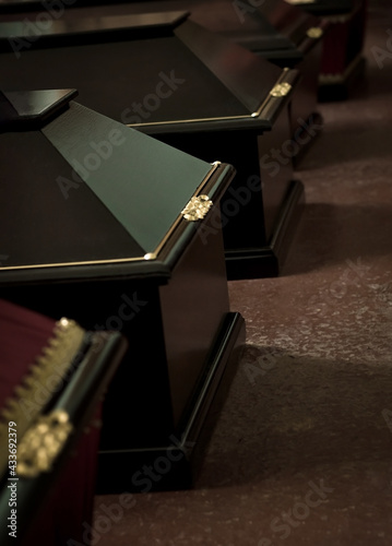 Several coffins in a row, funeral home, selective focus.