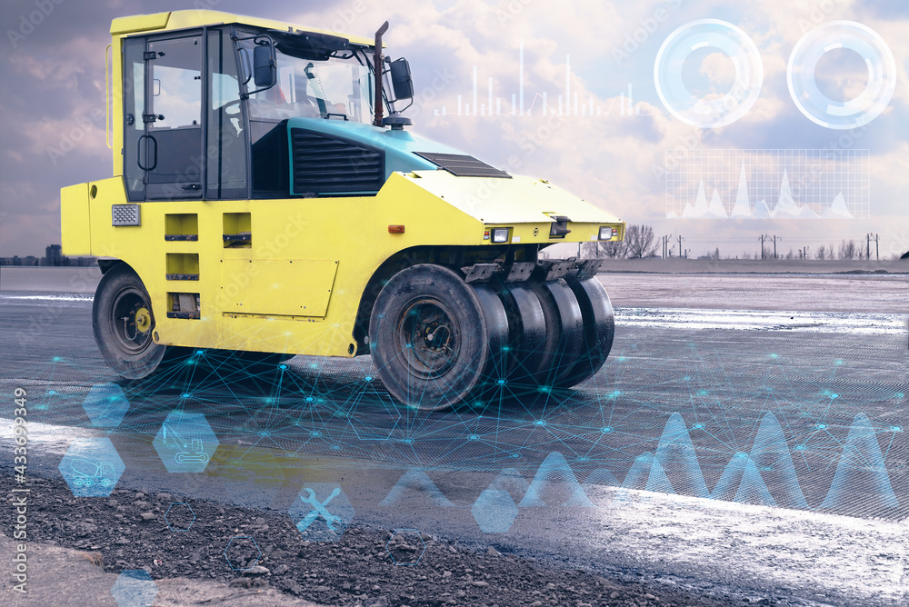road construction with a yellow road roller using high-tech technologies of the future road construction with a yellow road roller using high-tech technologies of the future