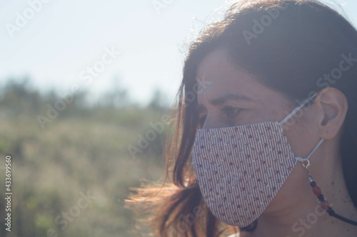 Closeup shot of a female in a facial mask - a new normal concept photo