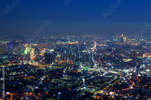 Scenic view of skyline in Seoul  South Korea  from above at night. Blockchain wireless network technology  smart city  5G and big data concept photo. Hexagon pattern on cityscape.