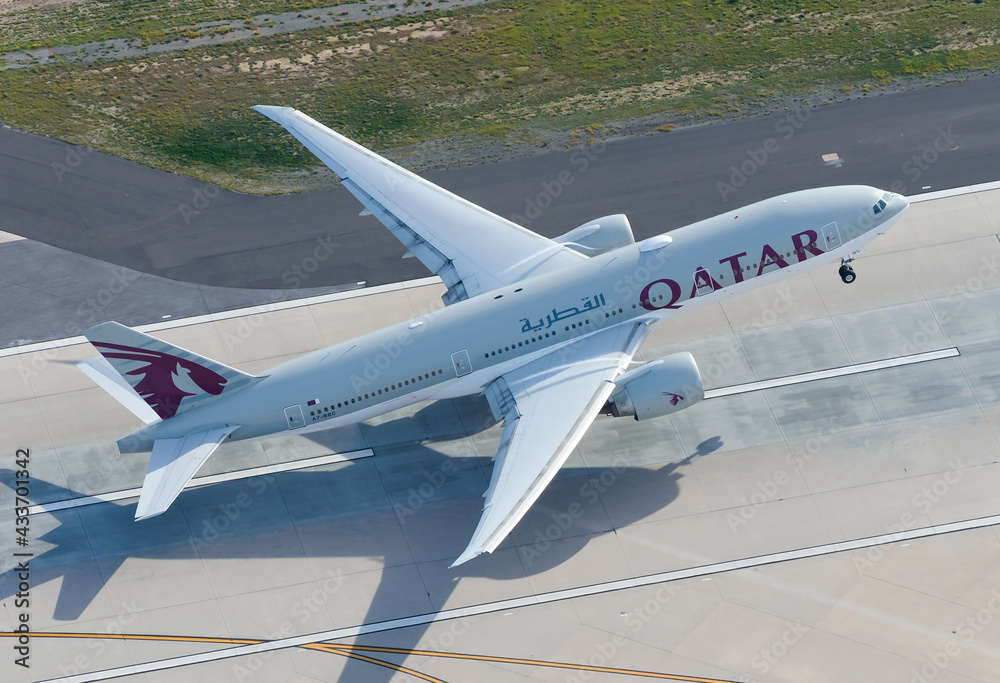 Qatar Airways Boeing 777 departing LAX International Airport runway