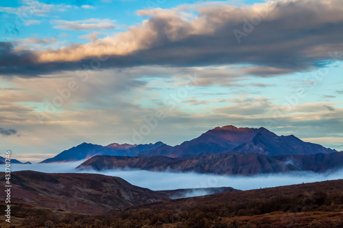 dramatic landscape of mountain peaks and mountain ranges inside Denali National Park during autumn season.