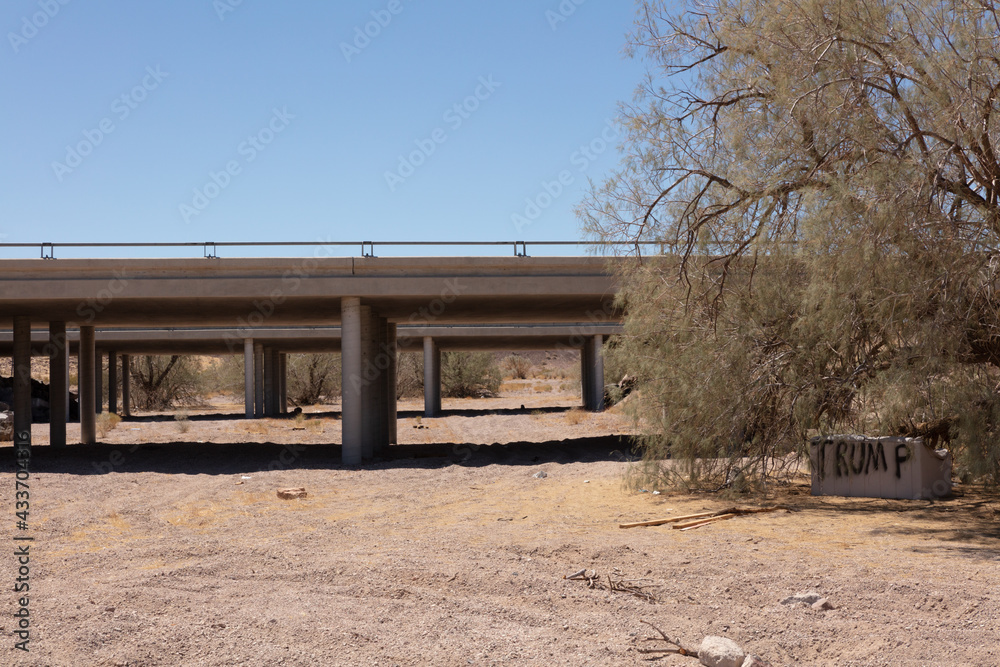 Dry wadi passing under a railway bridge in the arid Mojave Desert Dry wadi passing under a railway bridge in the arid Mojave Desert