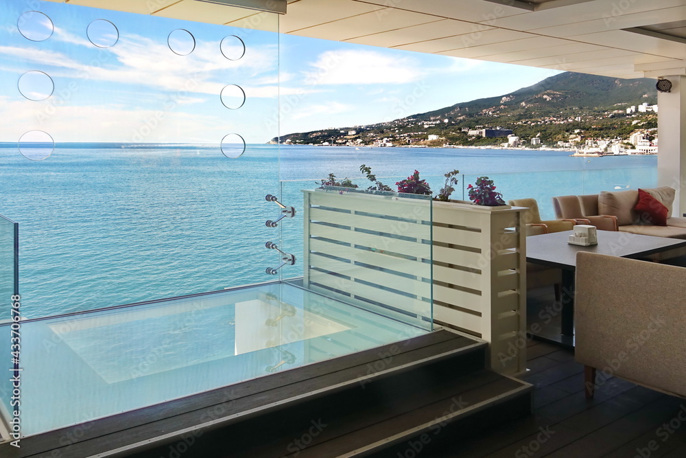 Fototapeta premium Modern Terrace With Panoramic Seaside View. Modern Interior Alfresco Restaurant Or Hotel Lounge Verandah With Seaview. Sea View Restaurant Modern Interior