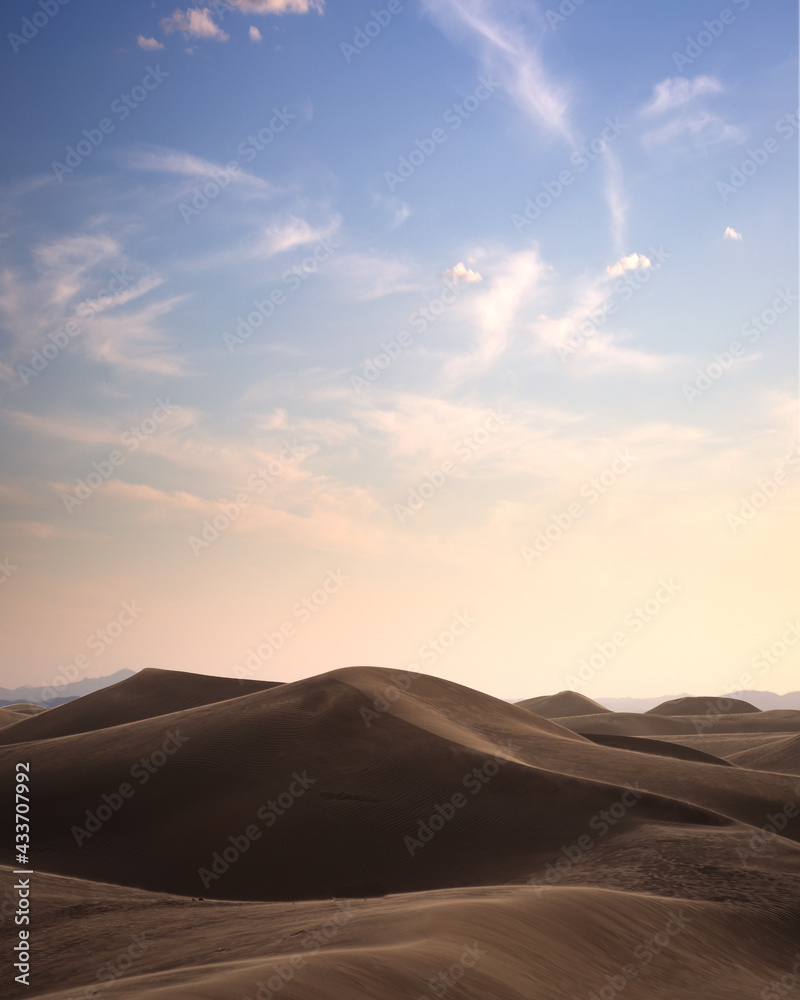 A view of desert dunes at sunset A view of desert dunes at sunset