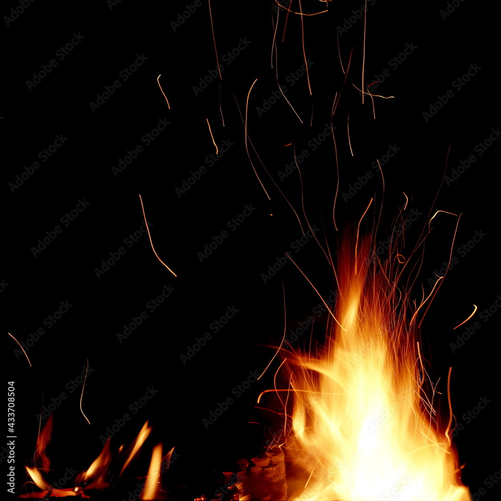 Flames Of Fire And Sparks Isolated On Black Background. Abstract Flaming Background. Magic Fiery Wallpaper. Flying Sparks Background,  Closeup View. Bonfire Flaming In The Night. Energy Concept.