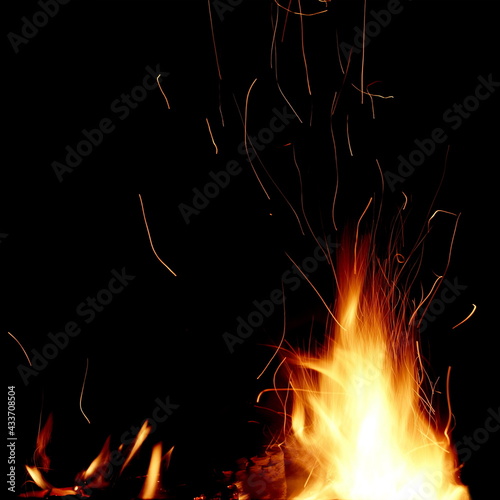 Flames Of Fire And Sparks Isolated On Black Background. Abstract Flaming Background. Magic Fiery Wallpaper. Flying Sparks Background, Closeup View. Bonfire Flaming In The Night. Energy Concept.