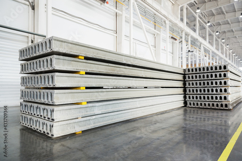 Stack of precast reinforced concrete slabs in factory workshop