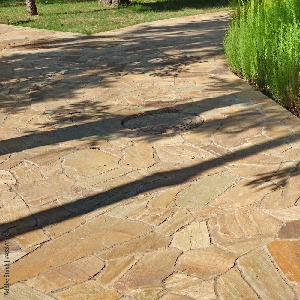 Garden landscaping with Pavement from Tiled Limestone. Backyard Garden