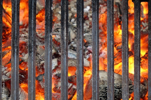 Barrel Or Brazier Grill Pit With Flaming Charcoal. Top View Of BBQ Hot Grill With Cast Iron Grid, Isolated Background, Overhead View. Barbecue Grill Background Texture