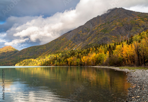 Fototapeta Naklejka Na Ścianę i Meble -  autumn foliage and mounter reflection on a tranquil lake in kenai peninsula , alaska