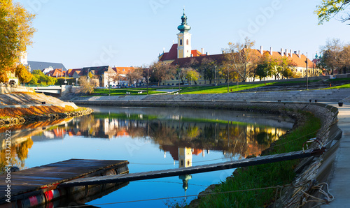 View of hungarian city Gyor with river Raba in sunny autumn
