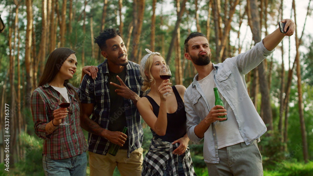 Relaxed people having fun on party outside. Happy guys making selfie on backyard Relaxed people having fun on party outside. Happy guys making selfie on backyard