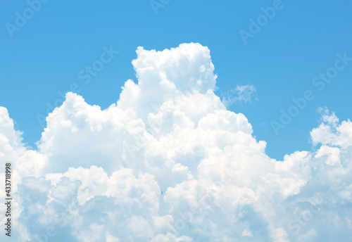 The sky is large, bright, beautiful and has white clouds.