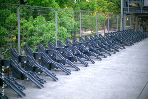 Fototapeta Naklejka Na Ścianę i Meble -  Tokyo,Japan-May 15, 2021: Parking area for bicycles or cycle parking space in Japan at dawn
