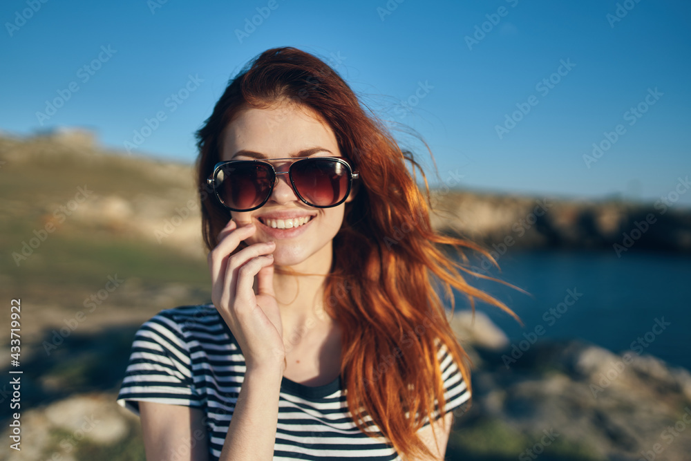 happy traveler in sunglasses in the mountains fresh air landscape happy traveler in sunglasses in the mountains fresh air landscape