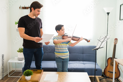 Young student showing his musical skills