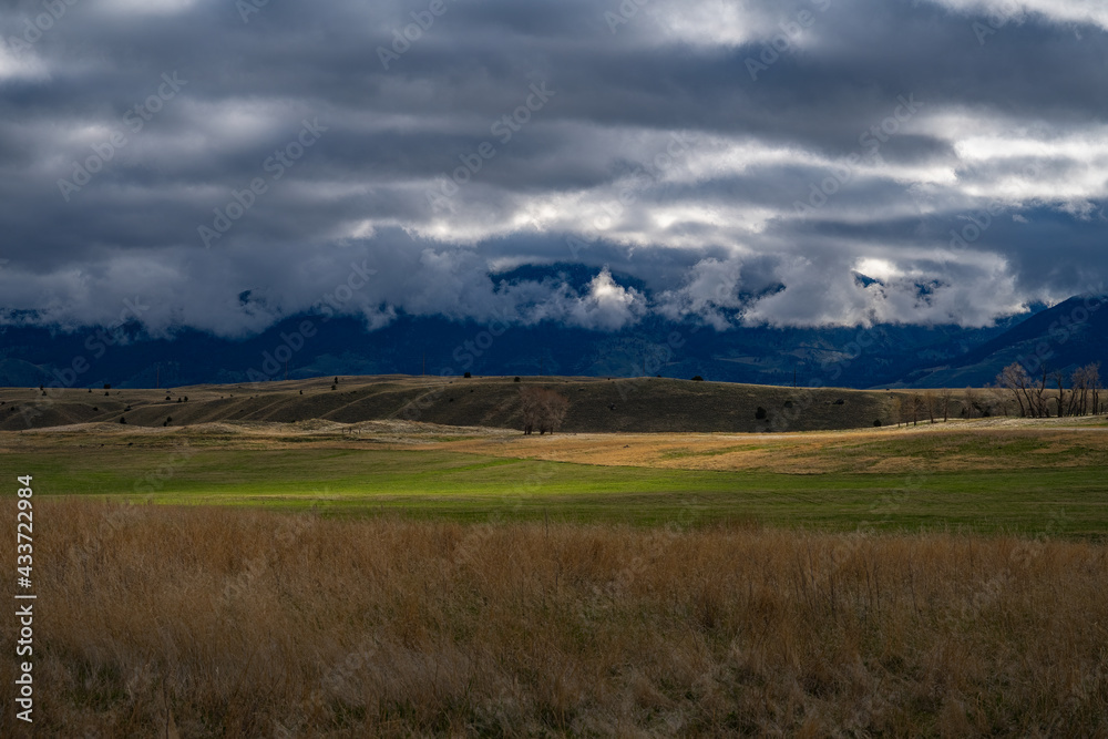  2021-05-09 OPEN SPACES WITH SUN STREAKS AND CLOUDY SKIES IN MONTANA 