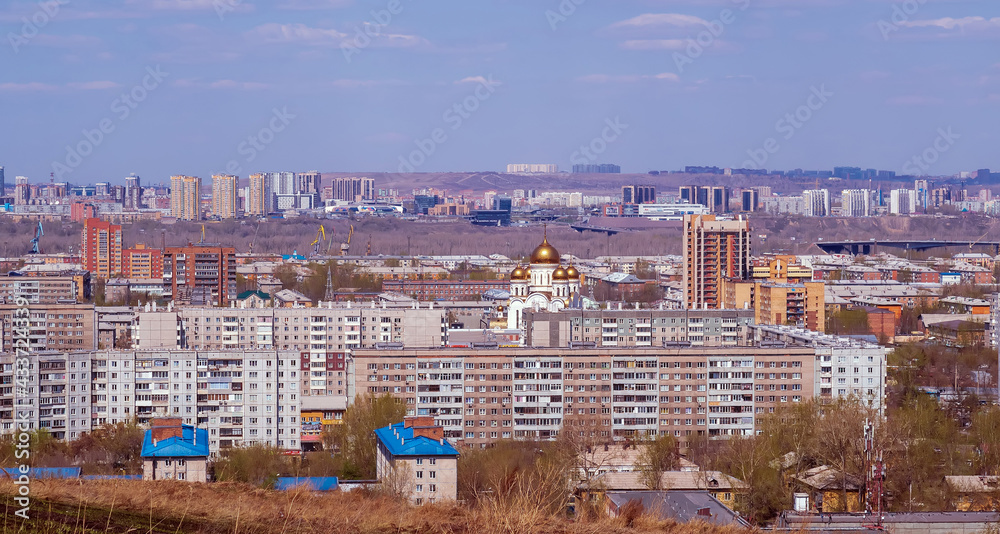 Cityscape. City skyline. Large city. View from hill.