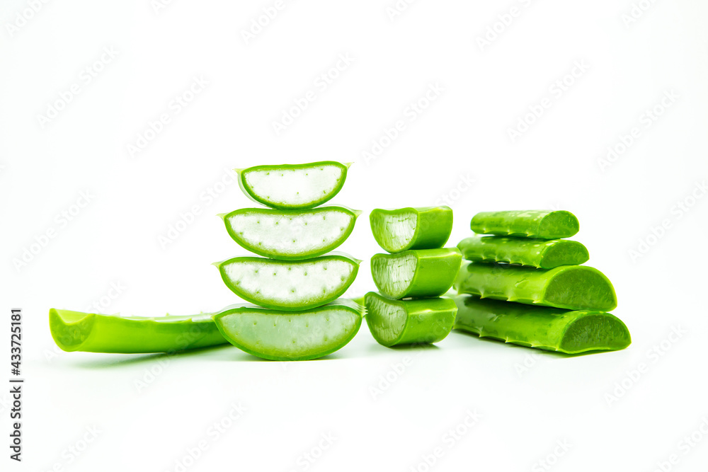 Aloe vera, Close-up slices of green fresh aloe vera plant stacked and aloe vera stalk or leaves with water dropping isolate on white background. Aloe vera, Close-up slices of green fresh aloe vera plant stacked and aloe vera stalk or leaves with water dropping isolate on white background.