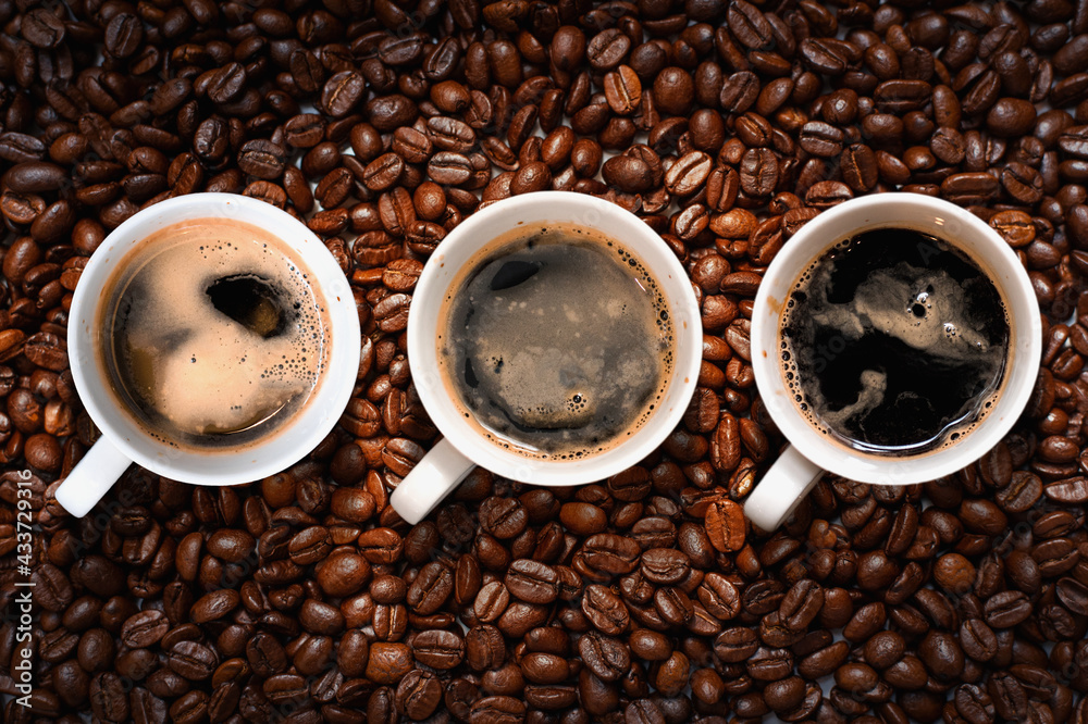 Fototapeta premium black coffee top view on coffee beans