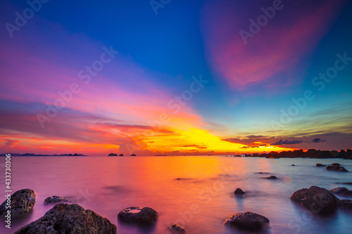 sunset over the sea © nattawut