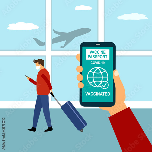 Covid19 vaccinated health passport on smartphone concept. Man looking vaccine passport on mobile screen while carrying luggage at the airport.