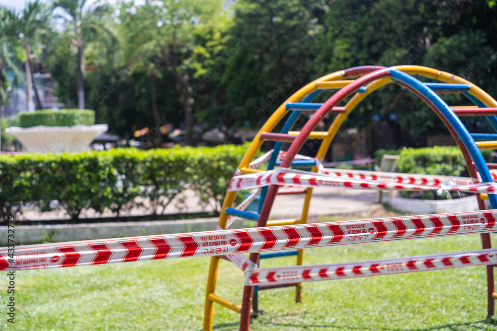 Park kids and children playground for game and activity empty and closed for Coronavirus or Covid19. And strips with word Park kids and children playground for game and activity empty and closed for Coronavirus or Covid19. And strips with word