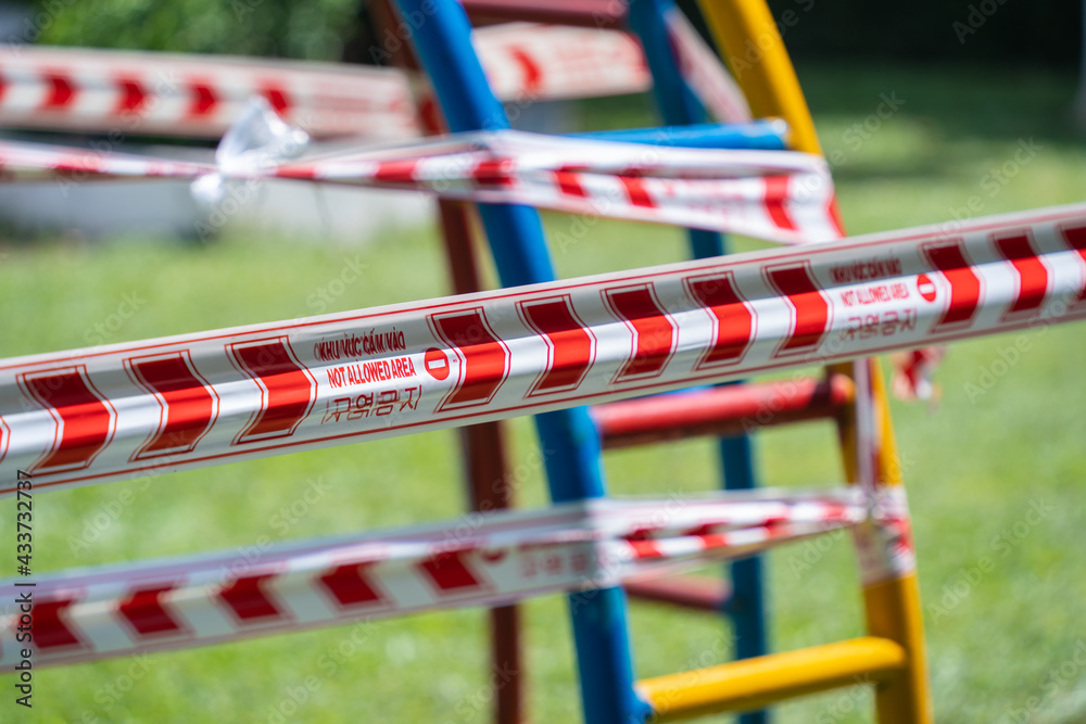 Park kids and children playground for game and activity empty and closed for Coronavirus or Covid19. And strips with word Park kids and children playground for game and activity empty and closed for Coronavirus or Covid19. And strips with word