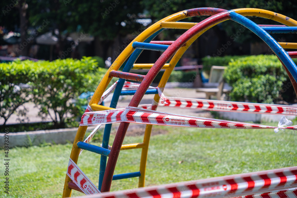 Park kids and children playground for game and activity empty and closed for Coronavirus or Covid19. And strips with word Park kids and children playground for game and activity empty and closed for Coronavirus or Covid19. And strips with word