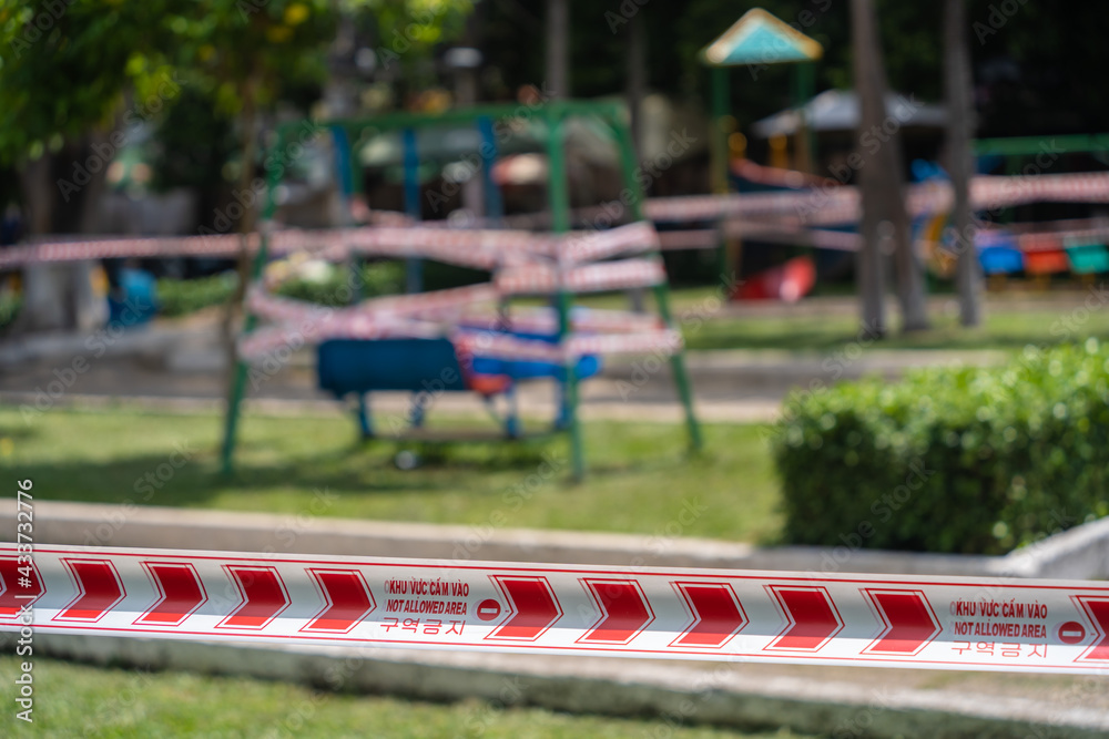 Park kids and children playground for game and activity empty and closed for Coronavirus or Covid19. And strips with word Park kids and children playground for game and activity empty and closed for Coronavirus or Covid19. And strips with word