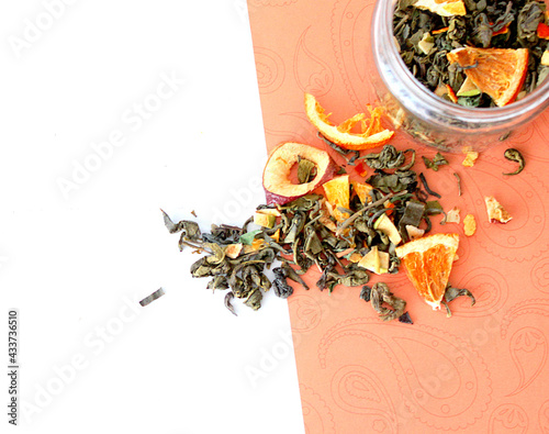 dried fruit in a jar and on the table. vegetarianism and healthy eating. energy for all time from healthy food. beautiful fruits in jars. weight loss. orange white glass. High quality photo