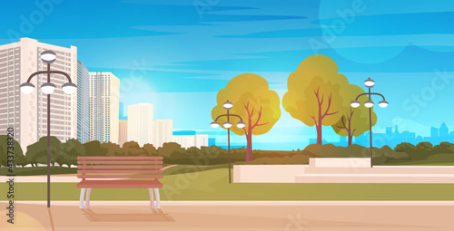 public park with wooden bench and streetlights cityscape background horizontal
