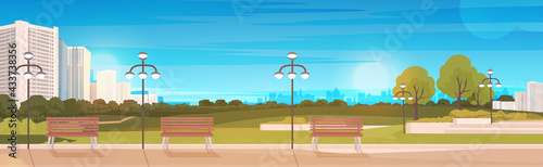public park with wooden bench and streetlights cityscape background horizontal