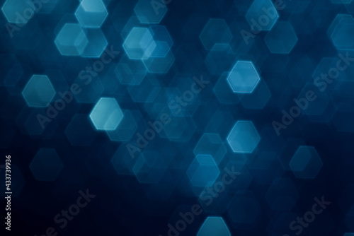 Glitter vintage lights falling down background. Silver, blue and dark defocused.