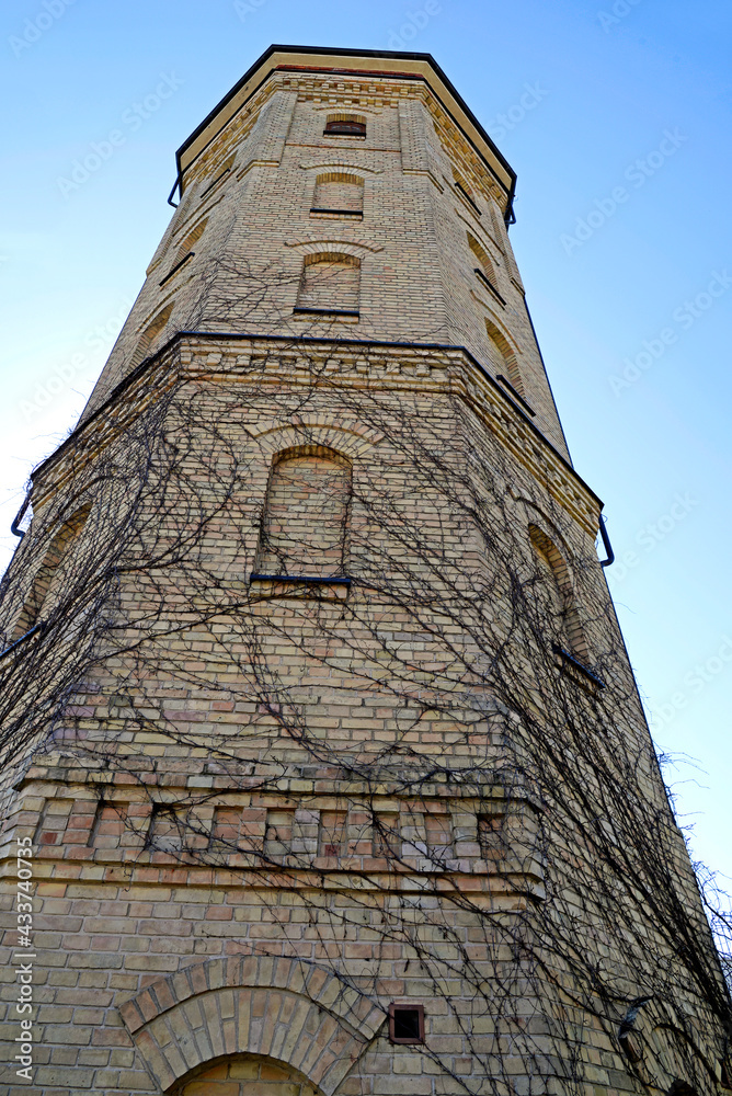 A brick water tower built in 1904 at the former textile factory, also known as the pressure tower at Augustowska Street in the city of Białystok in Podlasie, Poland.