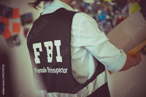 FBI woman in office. Close up. Alone in resolving the case. photo