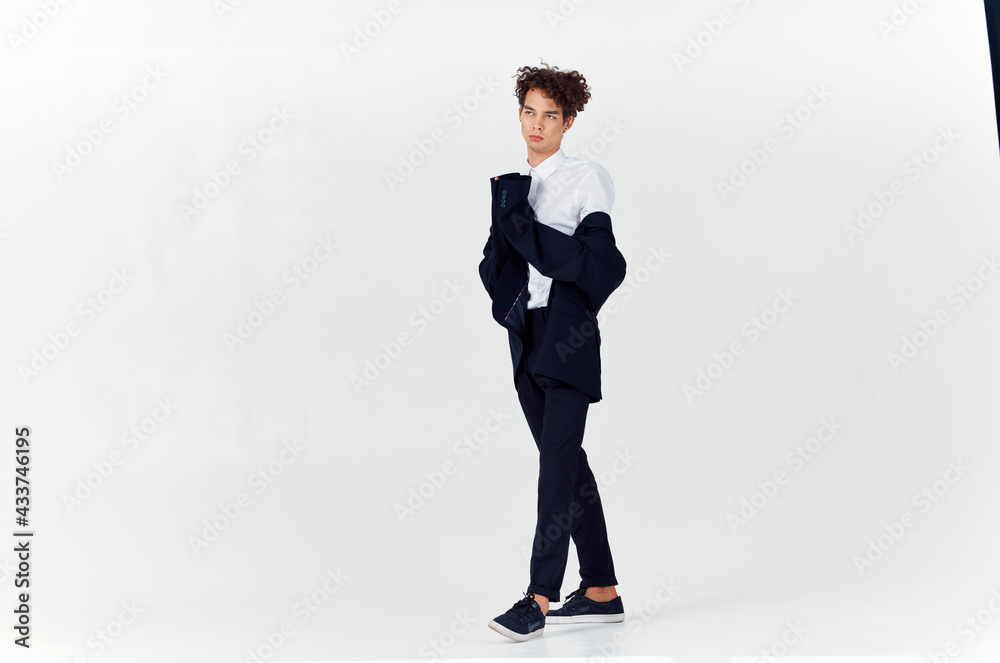 man curly hair suit modern style fashion posing man curly hair suit modern style fashion posing