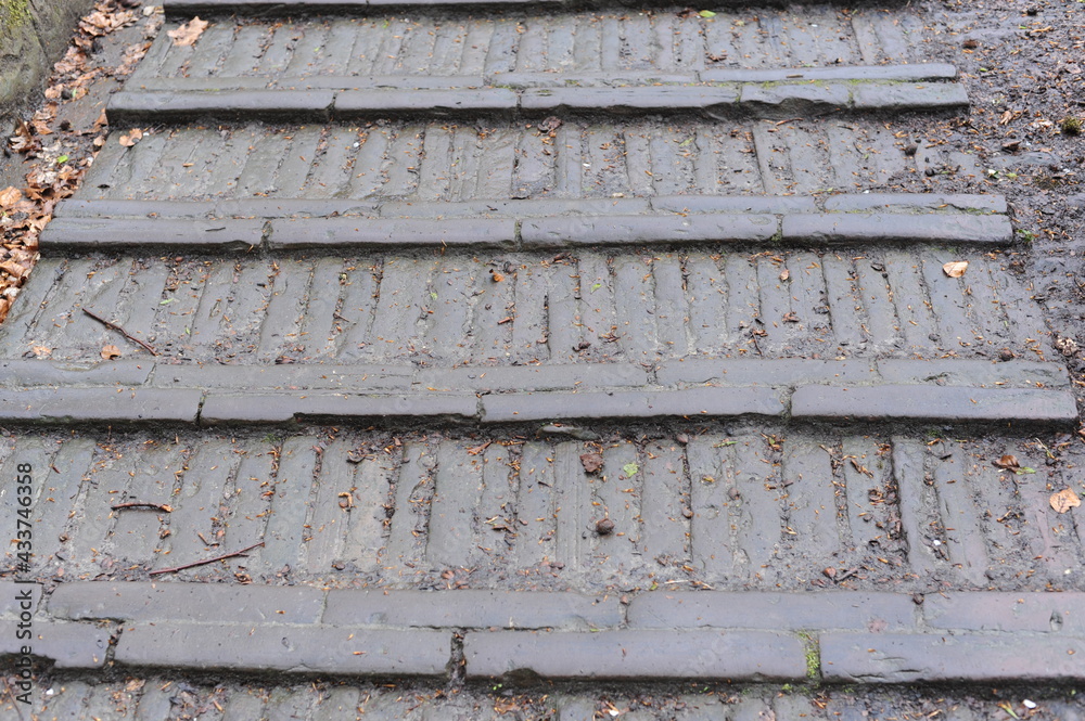 Old and antique stone stairs with sharp steps Old and antique stone stairs with sharp steps