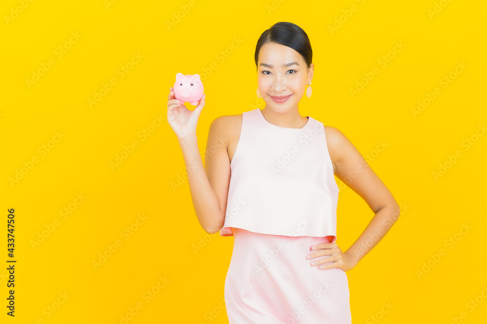 Portrait beautiful young asian woman with piggy bank Portrait beautiful young asian woman with piggy bank