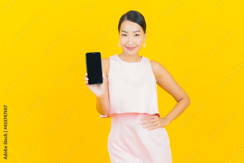 Portrait beautiful young asian woman smile with smart mobile phone Portrait beautiful young asian woman smile with smart mobile phone
