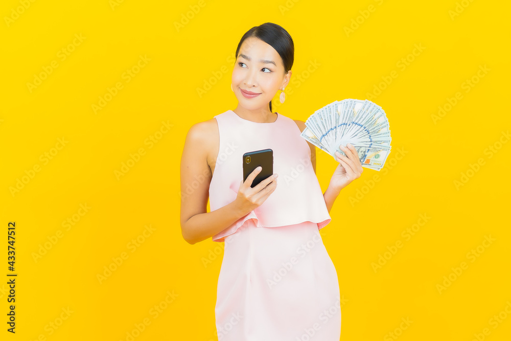 Portrait beautiful young asian woman smile with a lot of cash and money Portrait beautiful young asian woman smile with a lot of cash and money