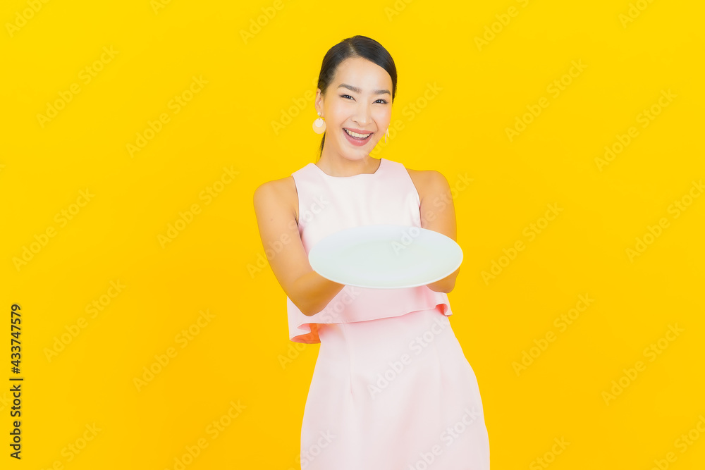 Portrait beautiful young asian woman smile with empty plate dish Portrait beautiful young asian woman smile with empty plate dish