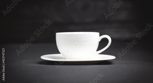 Coffee cup on the black background.