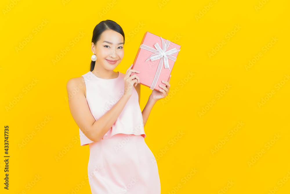 Portrait beautiful young asian woman smile with red gift box Portrait beautiful young asian woman smile with red gift box