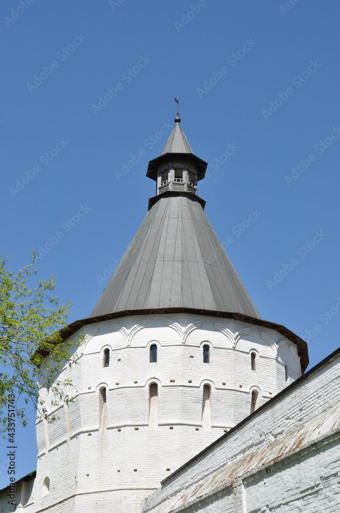 View of the northwestern tower and part of the wall of the Novospassky monastery. Novospassky Monastery, May 11, 2021, Moscow, Russia.